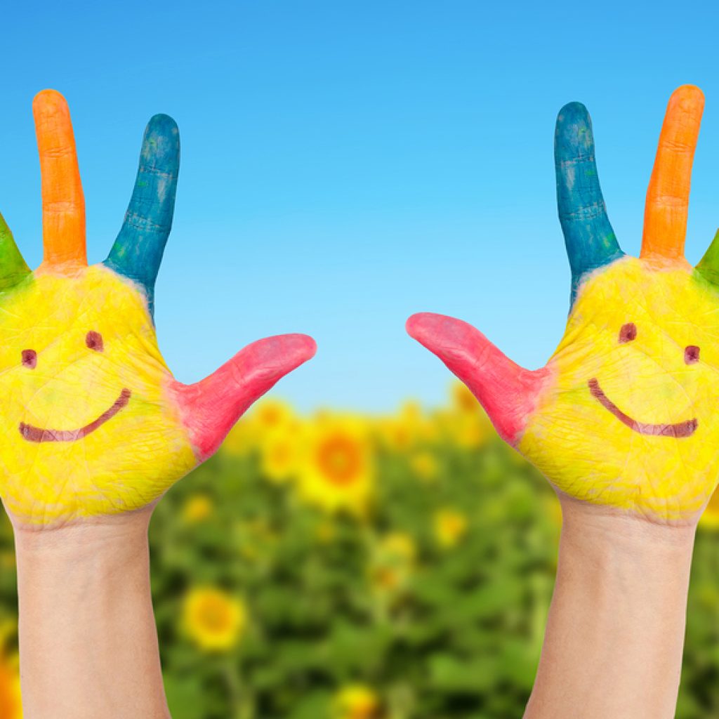 Two Smiley Hands In Sunny Summer's Day.