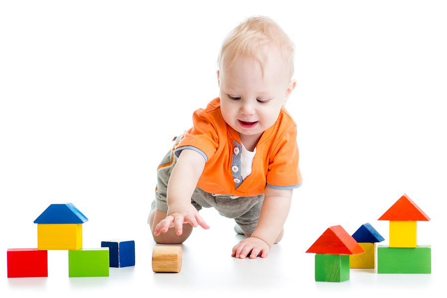 kid playing with block toys