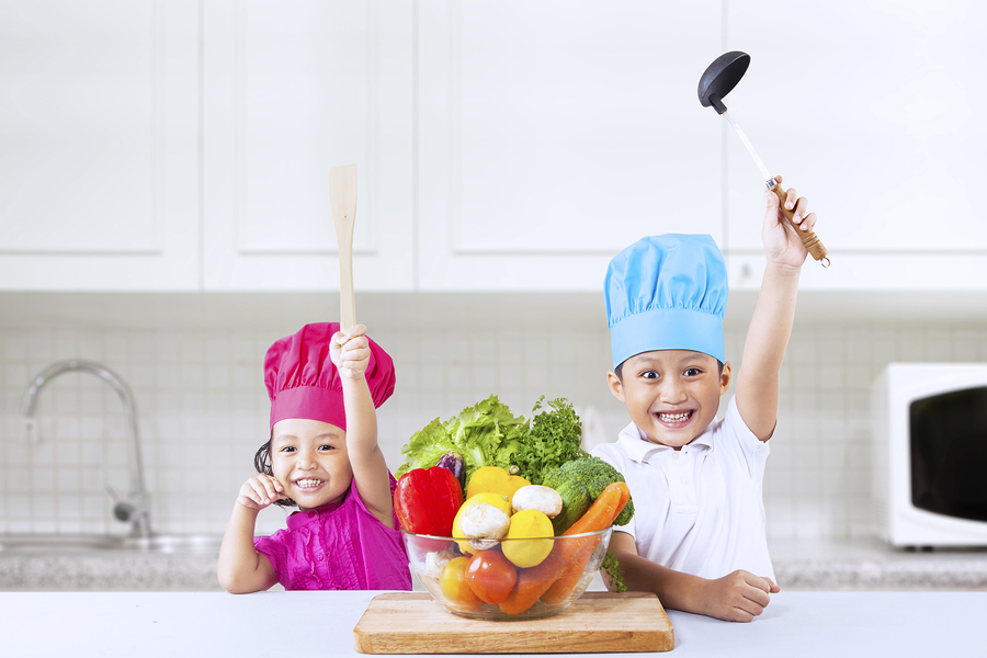cheerful chef kids in kitchen