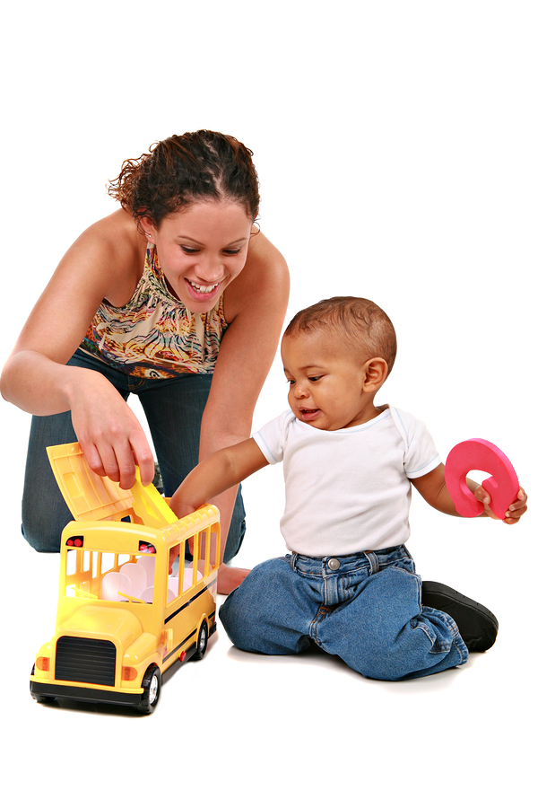 happy mother play with baby boy on isolated white background